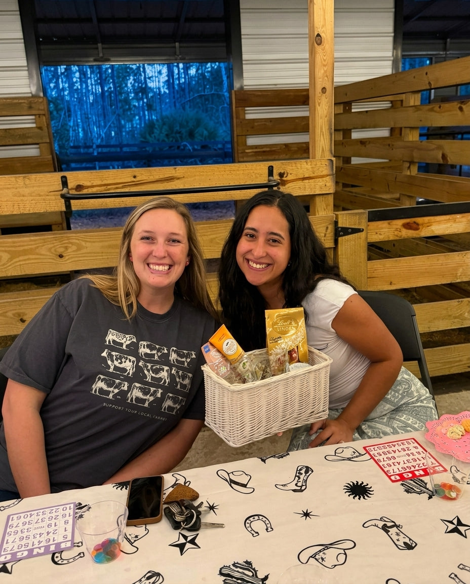 Guests smiling during Bingo Night inside the Rodeo Stables barn event space in Ormond Beach, Florida.