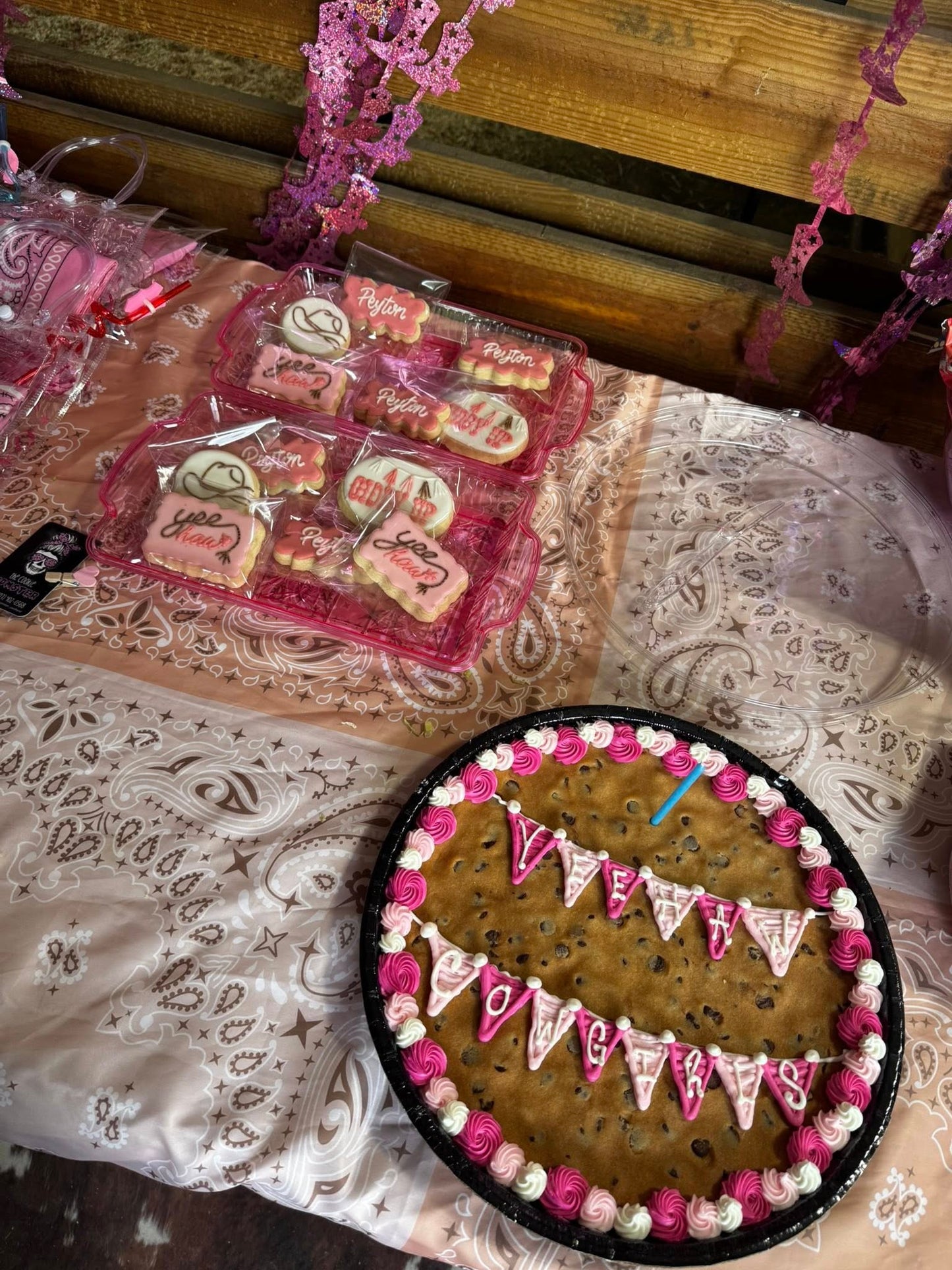 Western-themed cookie cake and desserts setup for a kids birthday party at Rodeo Stables.