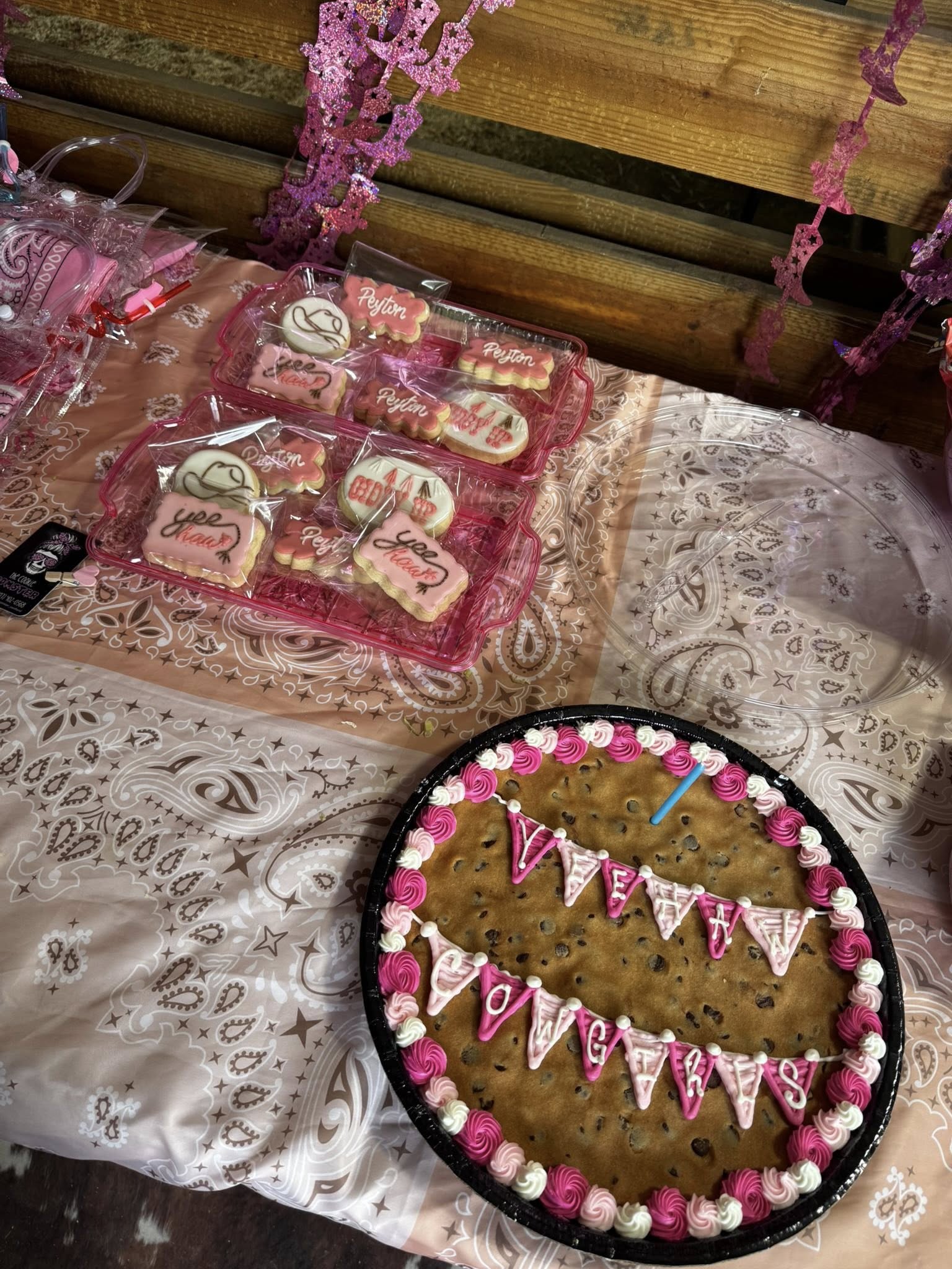 Western-themed cookie cake and desserts setup for a kids birthday party at Rodeo Stables.