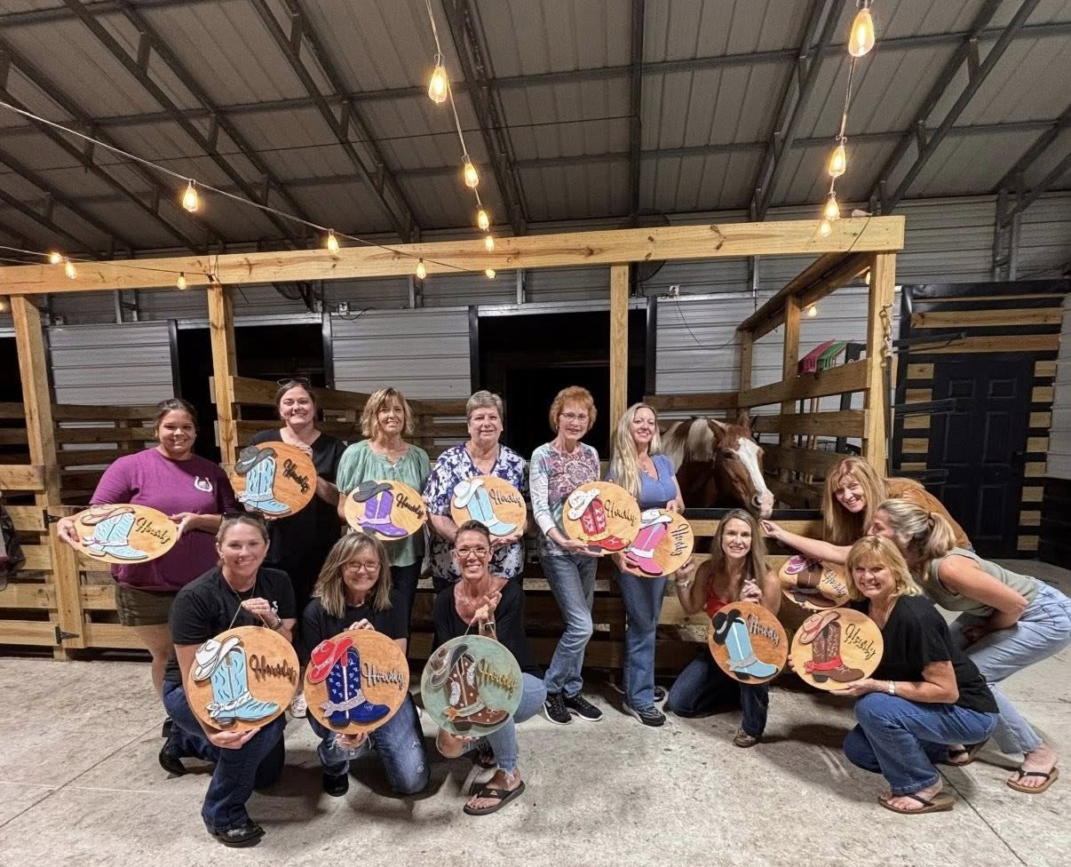 Group photo from a sip and paint ladies night event at Rodeo Stables in Ormond Beach, Florida