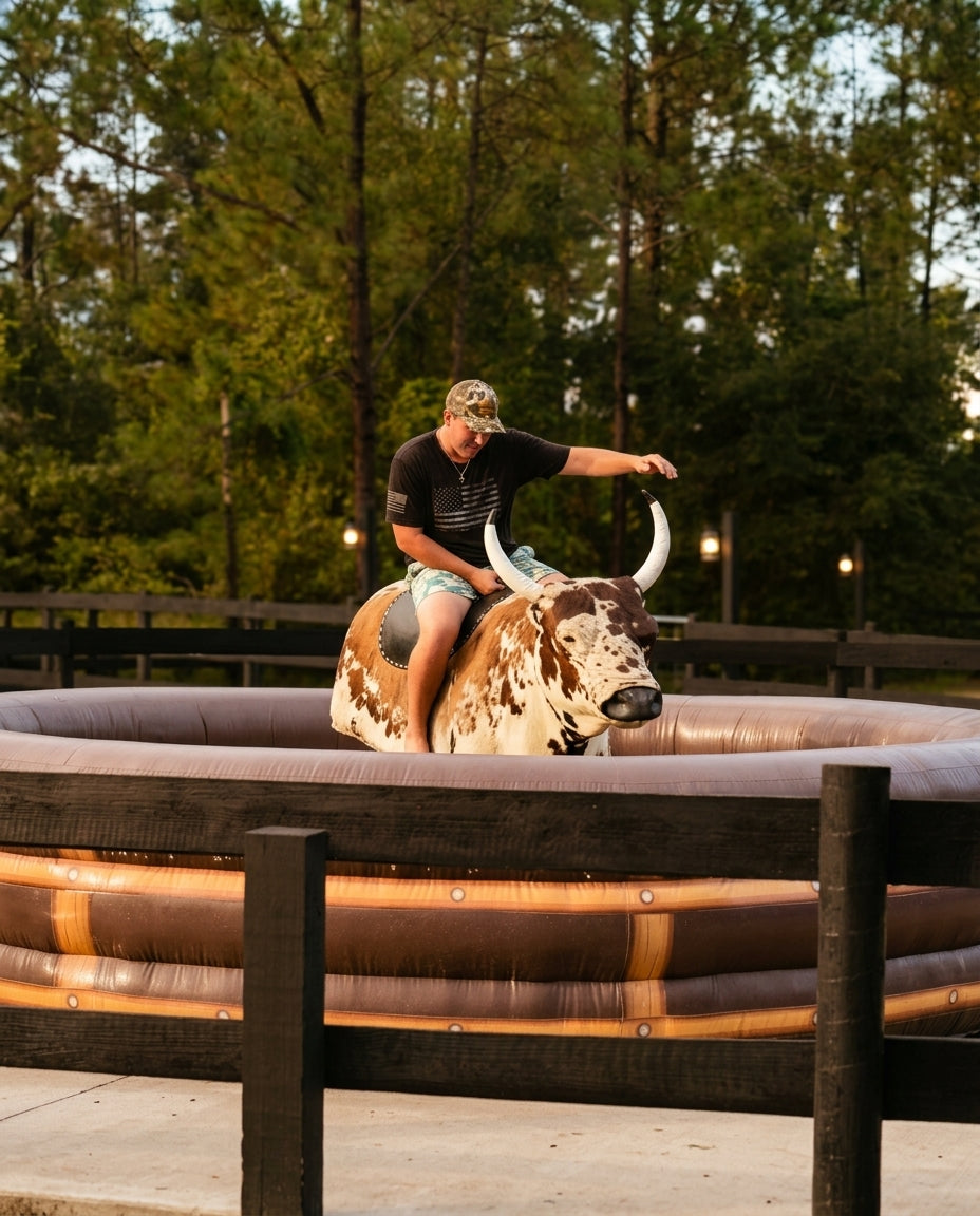 Mechanical bull riding attraction during a private western-themed event at Rodeo Stables in Ormond Beach, Florida